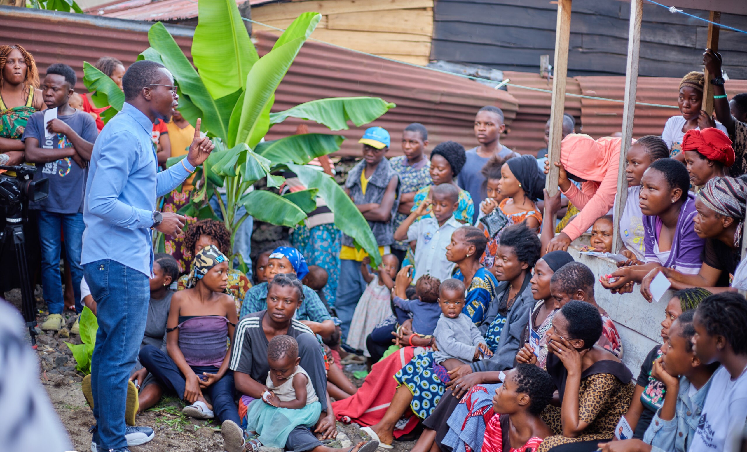 Espoir Ngalukiye speaking to a group