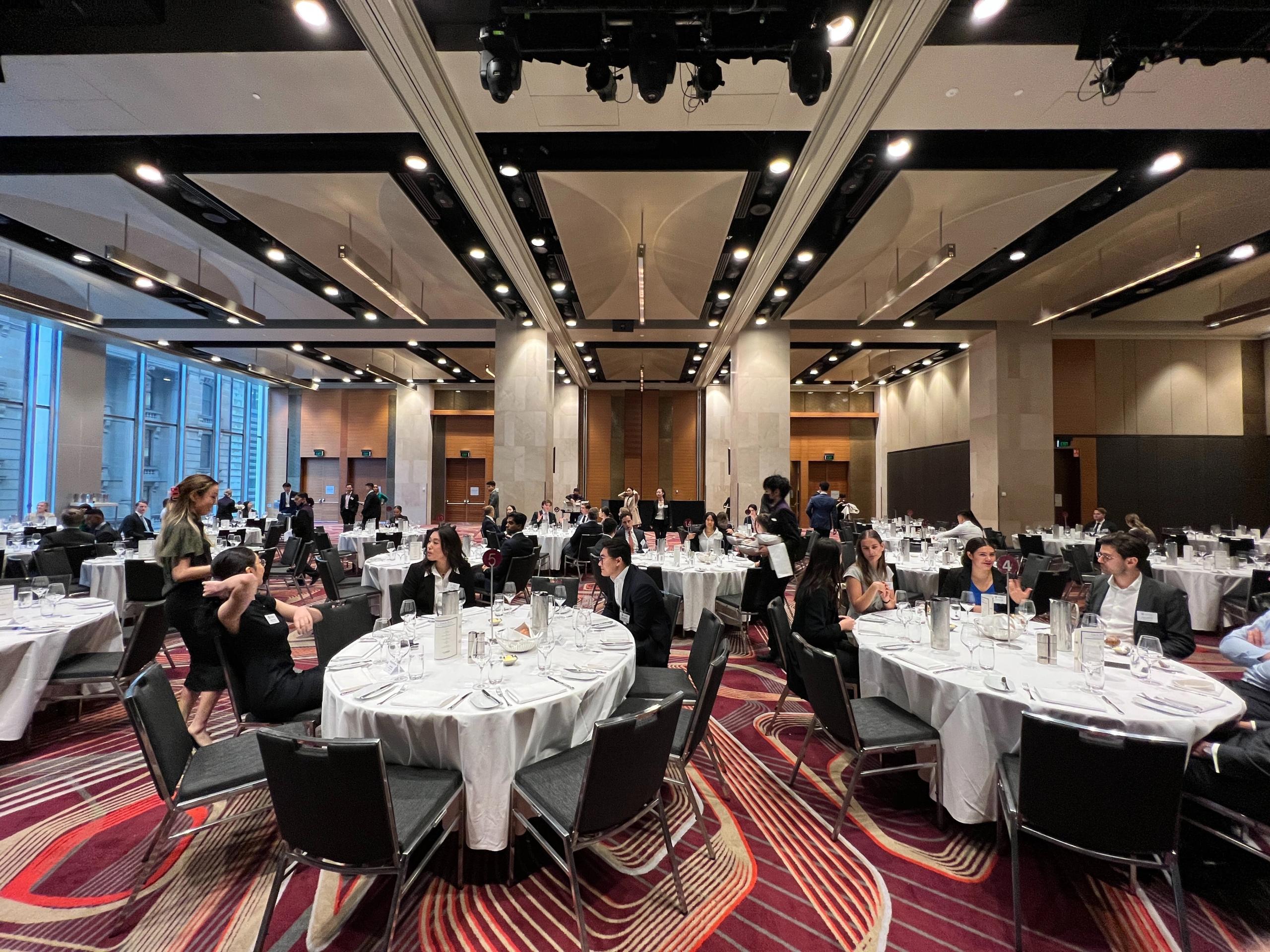 A group of people seated at a conference