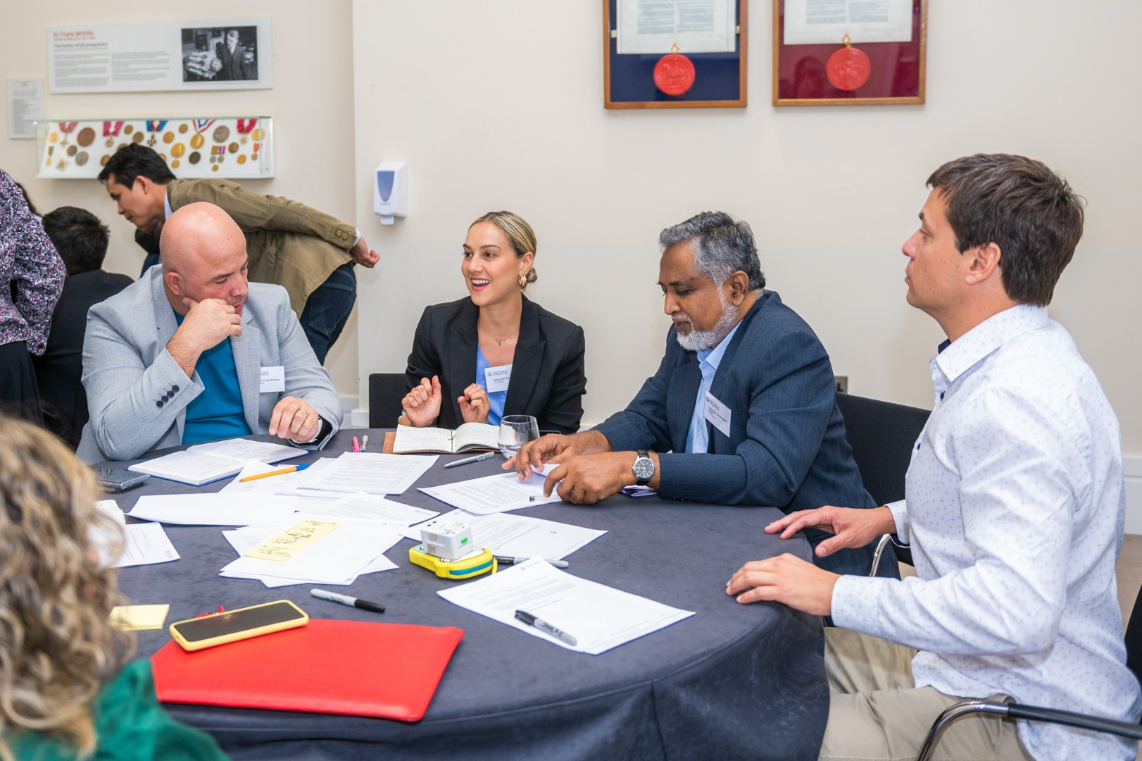 Group of people seated at roundtable