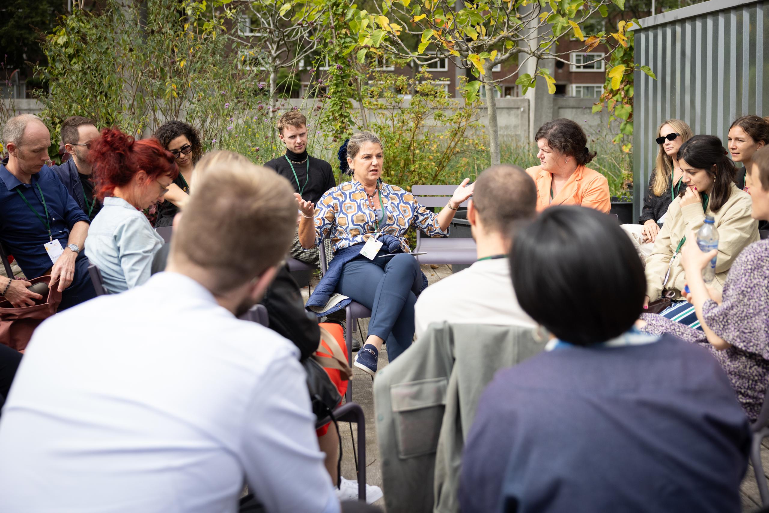 A group of people listening to one person